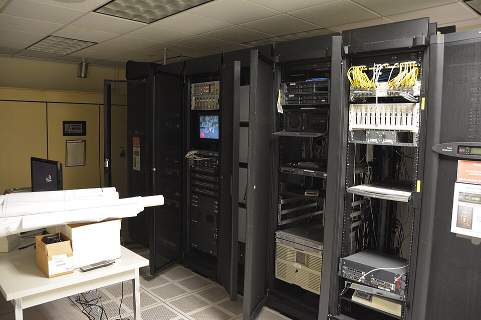 Server room, racks glowing in low light